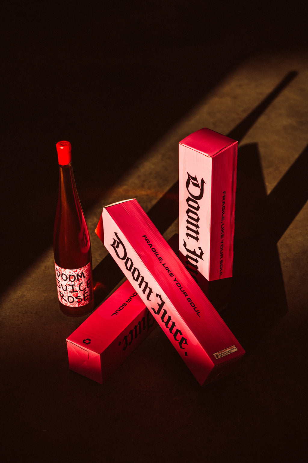 Red 'Doom Juice' bottles and packaging on a dark surface