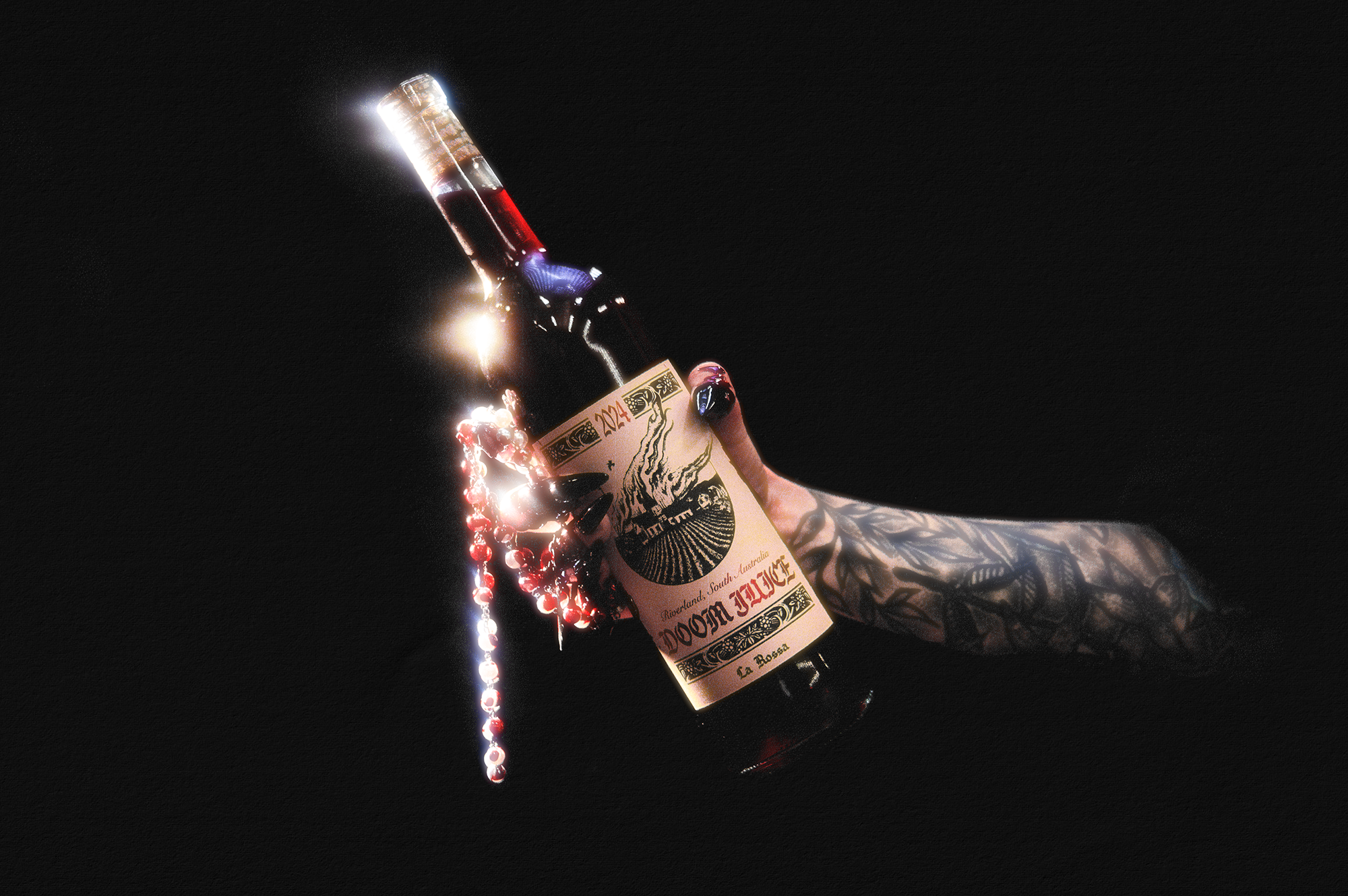 Bottle of Doom Juice in a hand against a dark background