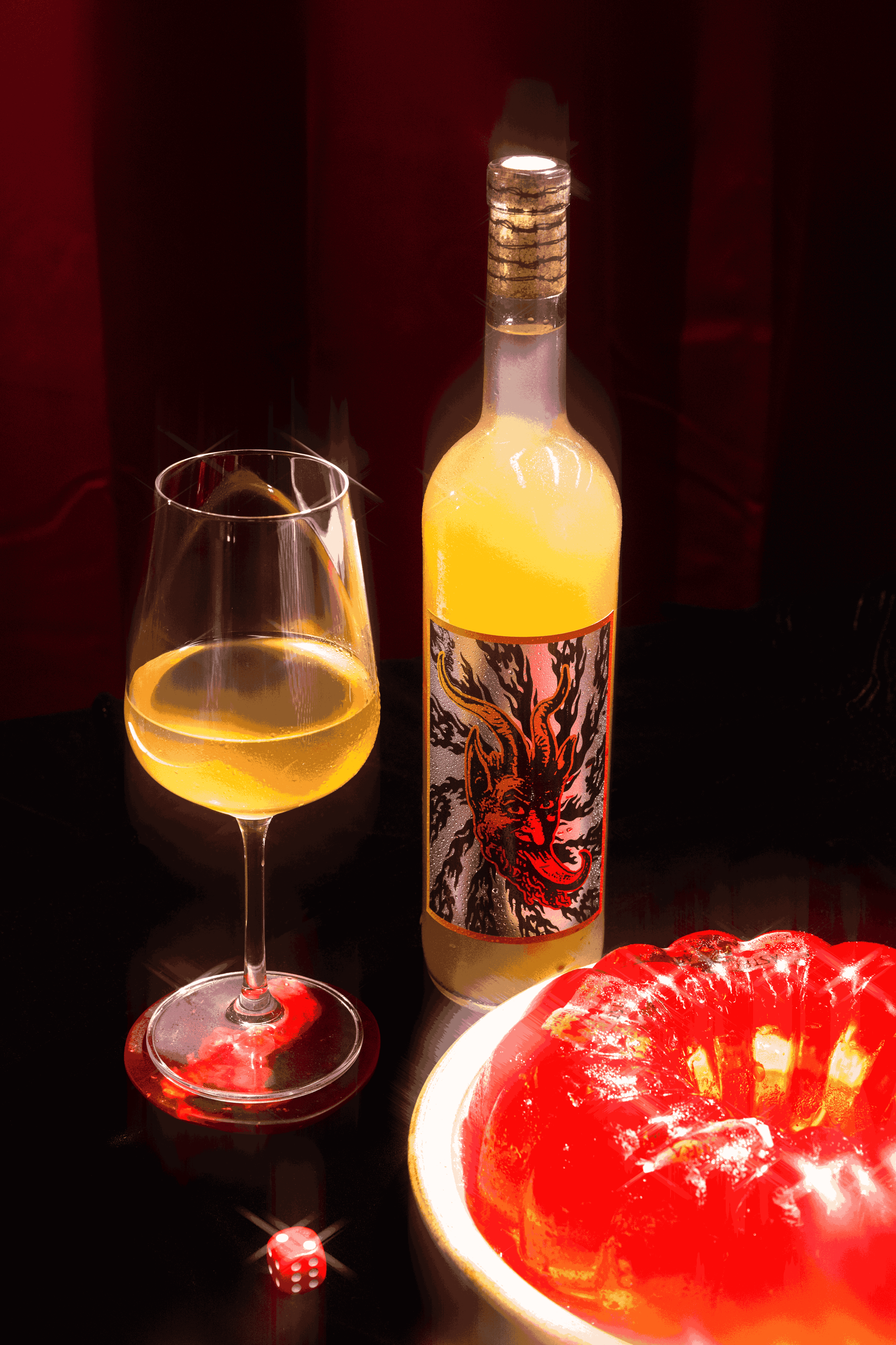 Bottle of wine with a glass and a red jelly-like dessert on a dark background